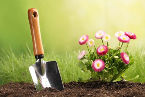 Trained landscaper using protective equipment on site